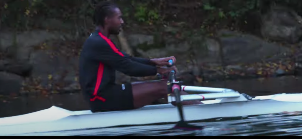 This image has an empty alt attribute; its file name is Marqus-Brown-rowing-2--1024x472.png